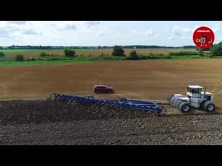 Big bud tractors pulling 21 and 18 bottom plows in ohio