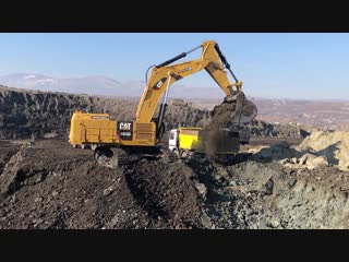 Cat 6015b excavator loading trucks with two passes sotiriadis brothers