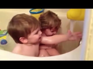 Twin baby bathtime babies discover the bath for the first time