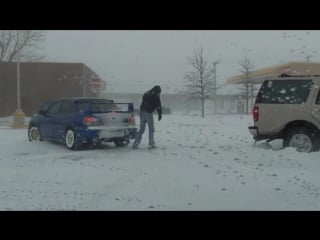 Sti helping a suv stuck in the snow