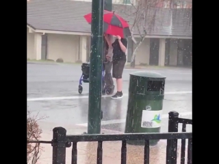 Teen helps elder across during hailstorm