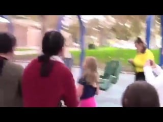 Selena taking photos with fans at a park in burbank, ca