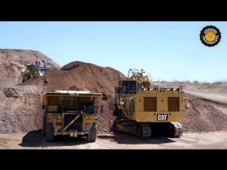 Caterpillar 6060 face shovel loading autonomous trucks