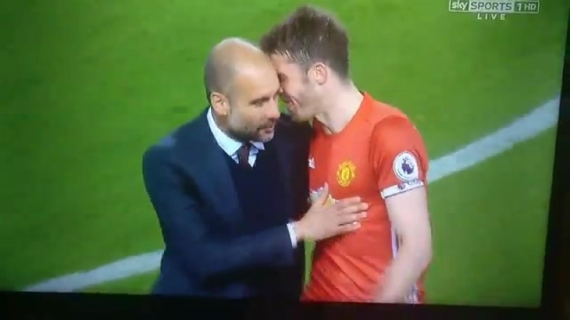 Michael carrick and pep guardiola after the full time