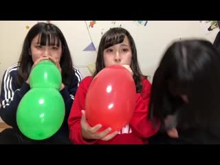 Japanese girls blow to pop oddly shaped balloons till they go bang