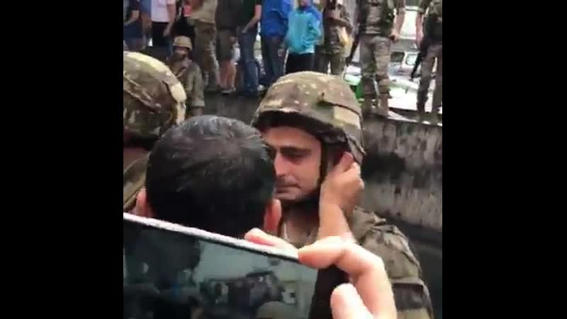 Soldier crying while carrying out orders to close the road to peaceful lebanese protesters