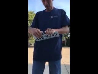 Robert nejedly tearing of two license plates