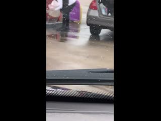 Woman tries to carry gas in plastic bag to her car's trunk