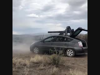 20mm vulcan cannon on top of a prius