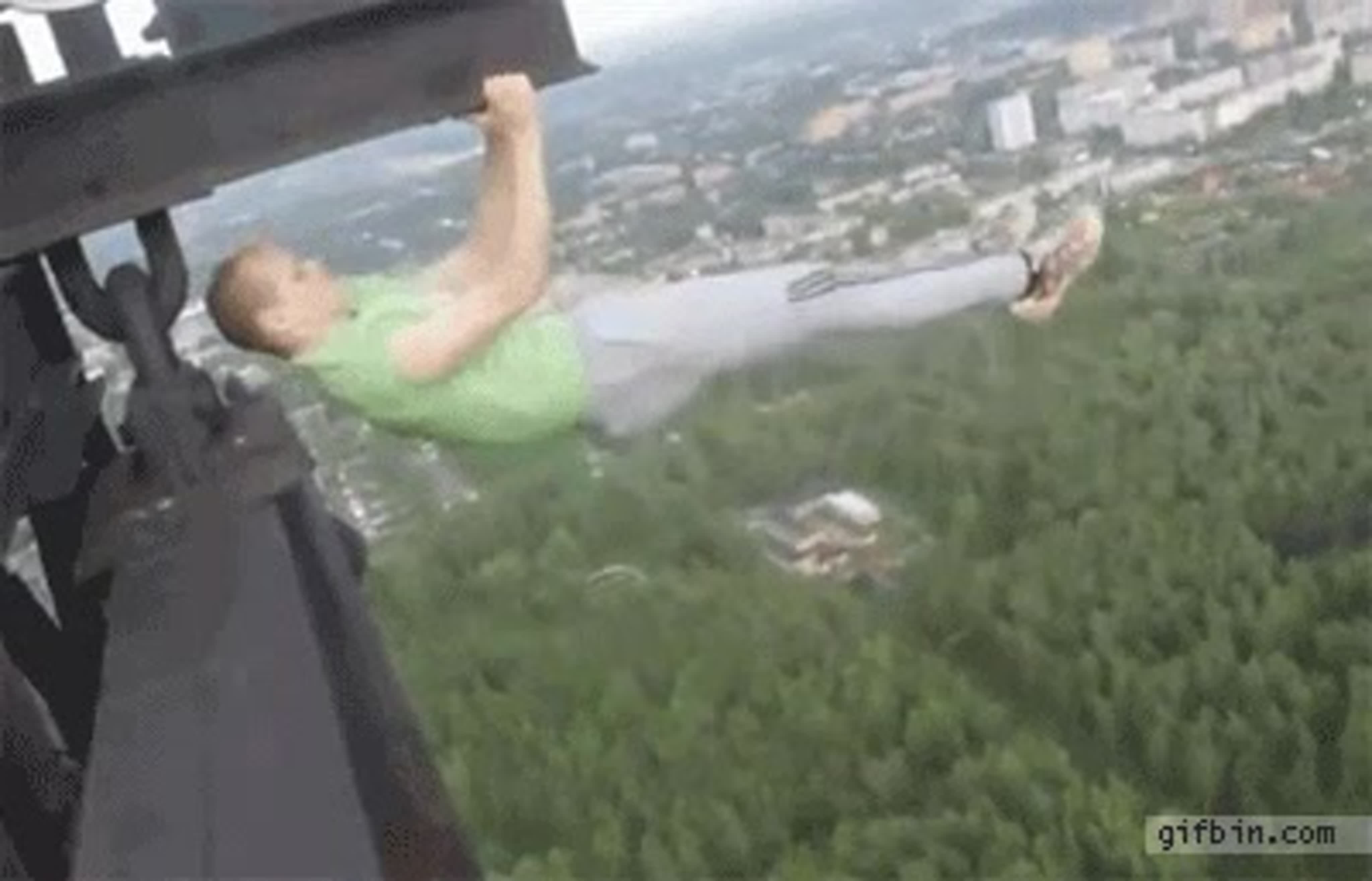 Russian guy hanging from tower stunt