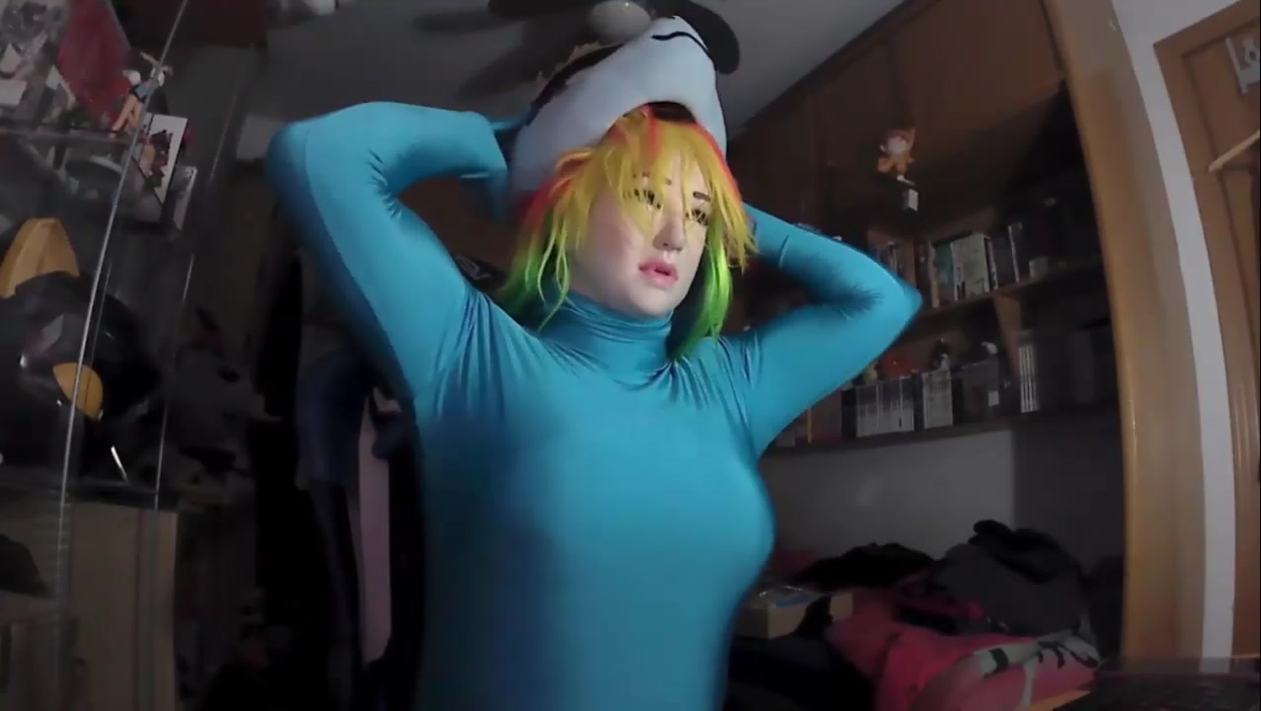 A kigurumi doll in a floral dress posing seductively