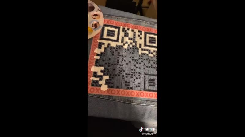 She painted the qr code for on mv on the back of her jacket