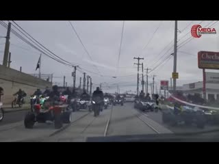 Driver caught between dozens of bikers and atvs running from dozens of police