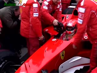 Michael schumacher drives his ferrari f2004 f1 on the famous avenue in paris