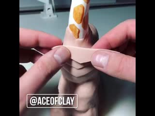 Turning a giraffe figurine into a dragon with polymer clay part 1