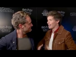 Jude law and eddie redmayne describe the moment they surprised fans at london's king's cross