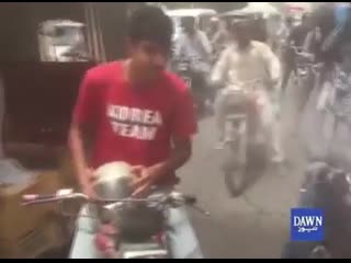 Video from pakistan, temperature almost 50 degrees this dude spraying cold water on people on roads