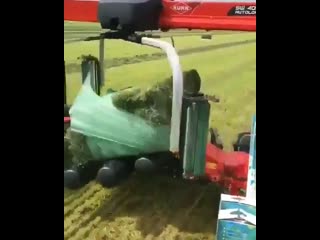 Kuhn sw 4014 square bale wrapper in action