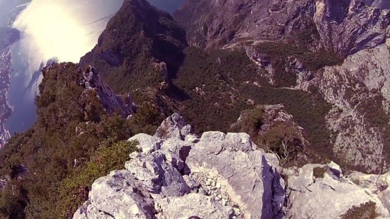 Crazy wingsuit flight man lands on water without parachute