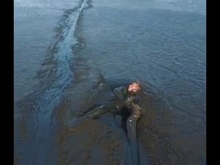Rescuing a baby eagle from the mud