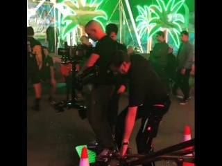 Grip rigs steadicam operator walks off gfm crane as grip