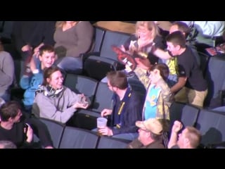 Girl proposes to boyfriend during kiss cam