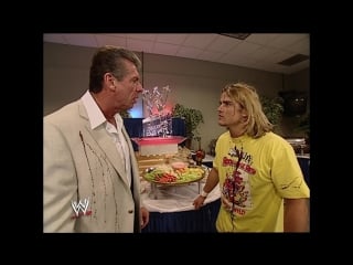 Smack spanky celebrates and accidentally sprays chocolate all over vince mcmahon's suit!
