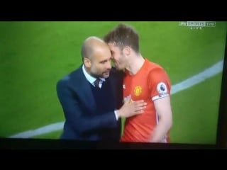 Michael carrick and pep guardiola after the full time