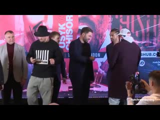 Oleksandr usyk sprays disinfectant to protect against coronavirus after face off with dereck chisora