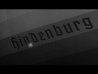 German zeppelin hindenburg (lz 129) parked in hangar as people look at it stock footage