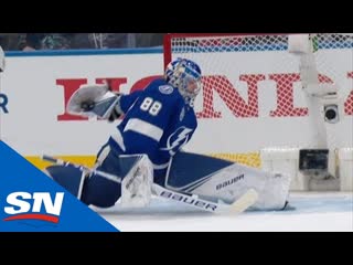 Andrei vasilevskiy pulls a behind the back glove save on mathew barzal