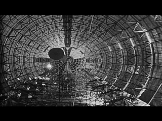 Cover placed on mesh of girders and wires during making of large airship uss stock footage