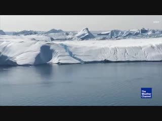 Iceberg cracks open in greenland falls into water rare videos