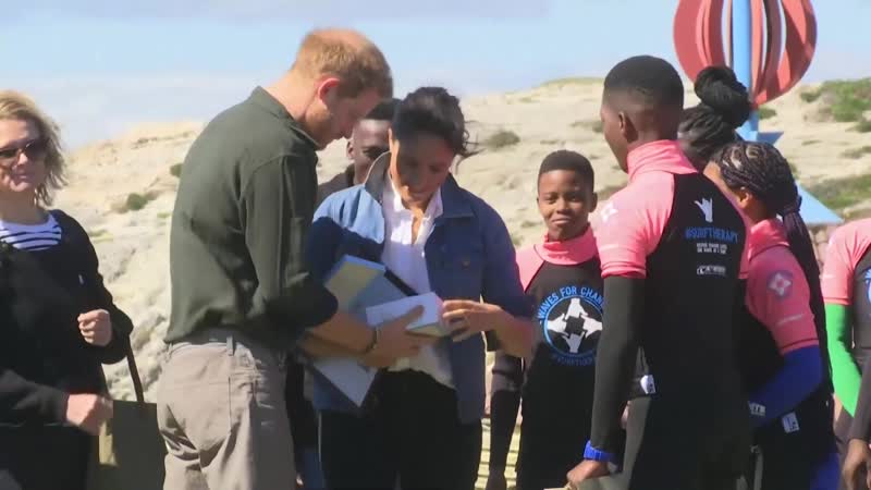 The duke and duchess of sussex show off their dance moves on visit to cape town's monwabisi beach