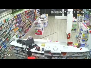 Boy steals money from cash register