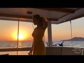 Striptease on boat emerald ocean