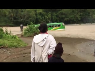 School bus crossing flooded river