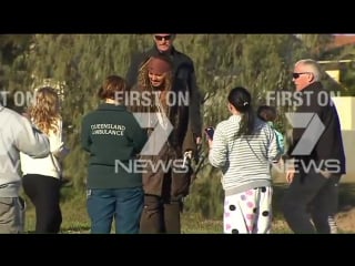 Locals on brisbane's bayside getting selfies with captain jack sparrow