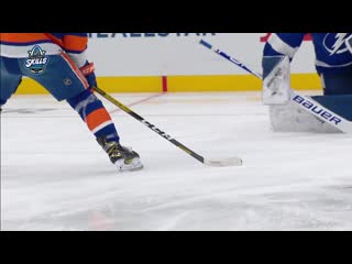 Andrei vasilevskiy pulls a behind the back glove save on mathew barzal