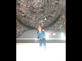 Valentina at punta della dogana in front of a sculpture done by @damienhirst inspired by the aztec calendar mi valentina en pu