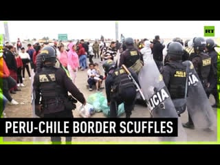 Migrants scuffle with police at peru chile border