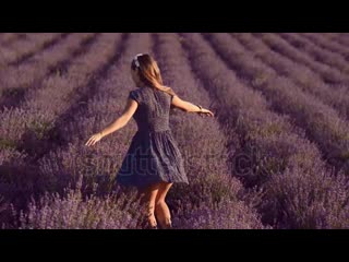 Stock footage stylish girl with long hair spinning into blossoming field of lavender slow motion mp4