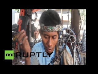 Indonesia partially paralysed bali man creates self made bionic arm