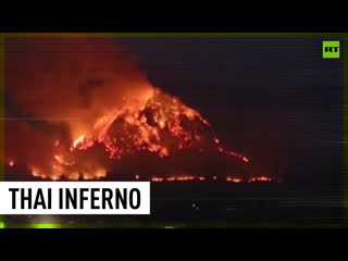 Huge wildfire engulfs mountains in thailand