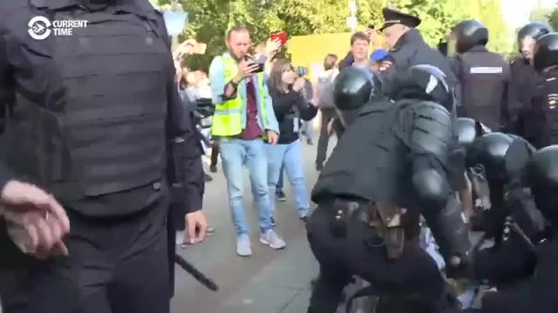 Russian police brutally club peaceful protesters on the ground in todays moscow demonstrat
