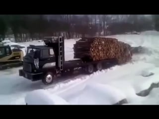 Truck driver unloading logs like a boss