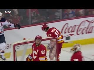 Gotta see it johnny gaudreau blows a tire, deflects puck into flames net