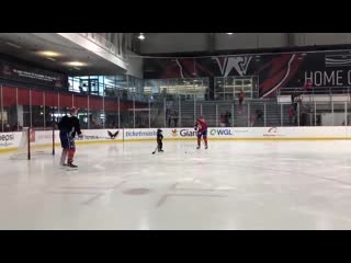 John carlson and his son lucca out on the ice after practice with jakub vrana