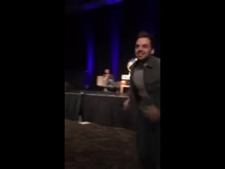 Sebastian running down to hug a fan who froze up during her question in wizard world tulsa