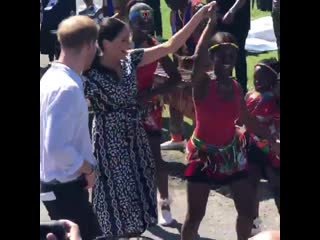 Lovely scenes as harry and meghan depart nyanga, with a spot of dancing from the duchess this time!